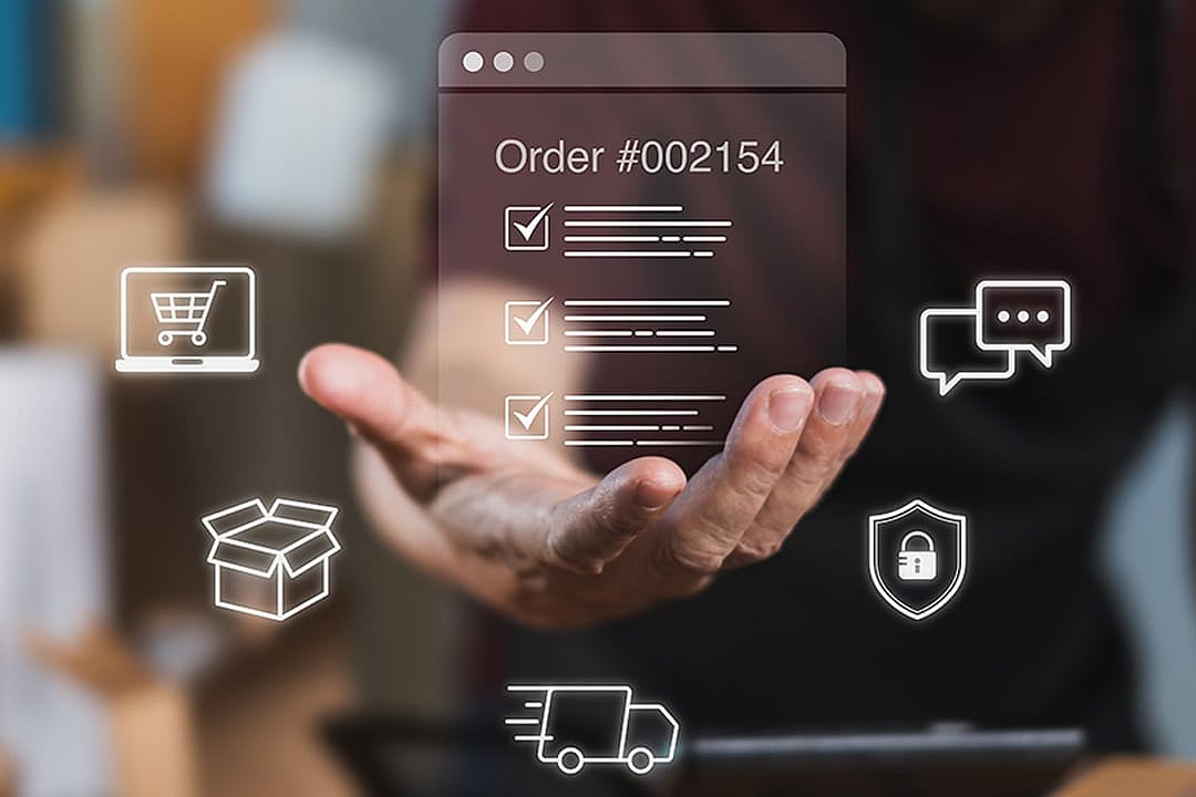 A worker checking digital order checklists surrounded by shipping packages.